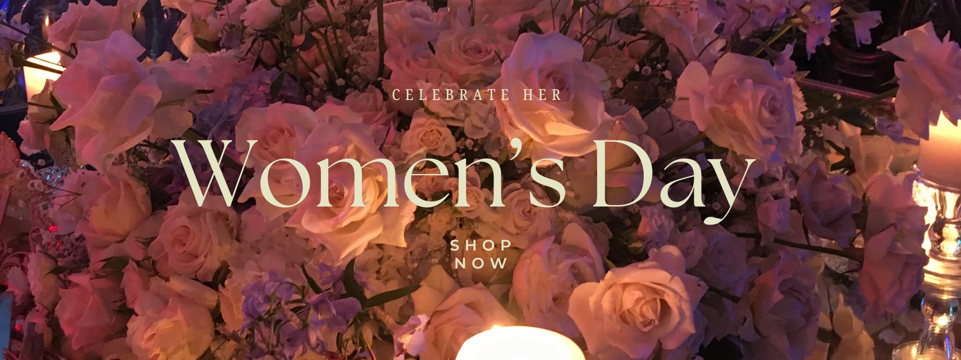 Women’s Day display with vibrant flowers and an inspiring message