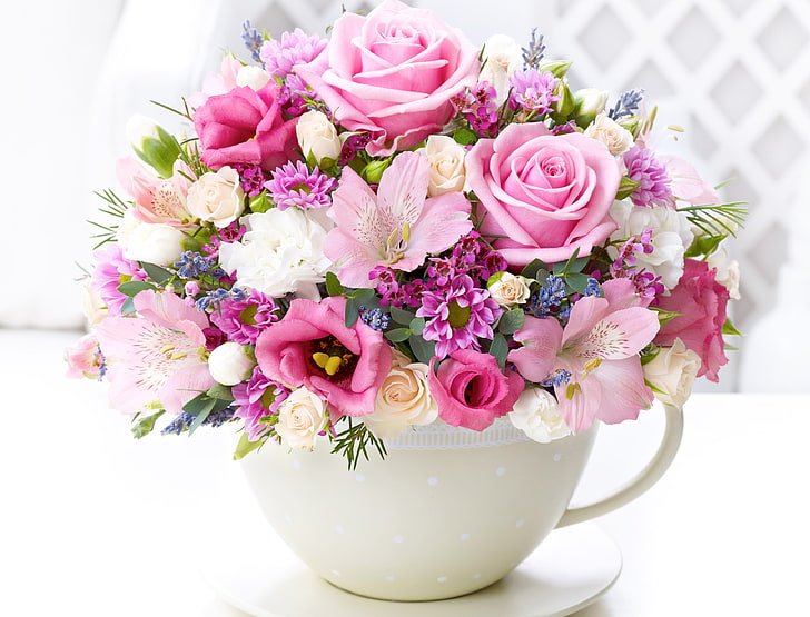 Elegant arrangement of birthday flowers, featuring roses and lilies, designed to make any birthday celebration memorable.